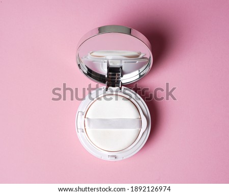 Face compact makeup powder. Realistic cosmetic powder in the white round plastic case with mirror. Isolated on pink background. Top view. Luxury Make-up powder ads, illustration design. mockup compact Royalty-Free Stock Photo #1892126974