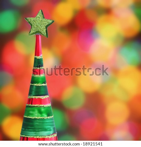 Christmas tree ornament with background of defocused Christmas lights