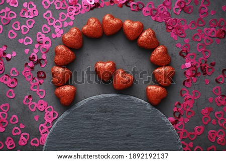 Romantic background. The concept of love and relationships. Heart shaped figures on dark background. Card for Valentine's Day.