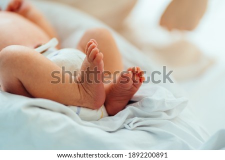 New Born Baby Feet on White Blanket In Hospital Royalty-Free Stock Photo #1892200891