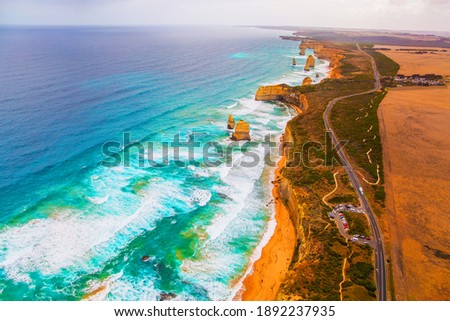 The Twelve Apostles are a group of limestone rocks in the Pacific Ocean near the coast. Australia. Aerial view. Great Ocean Road. Helicopter flight over the scenic Pacific coastline. Royalty-Free Stock Photo #1892237935