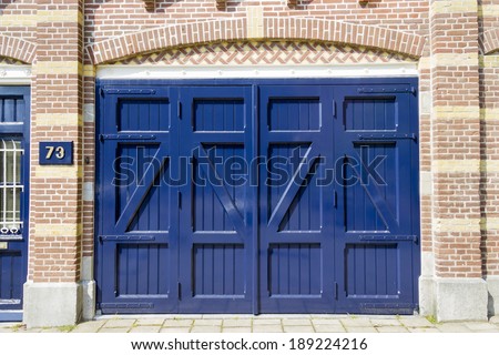 Ancient blue wooden door  background at house number 73