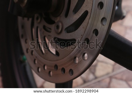 Close up of motorcycle disc brakes Royalty-Free Stock Photo #1892298904