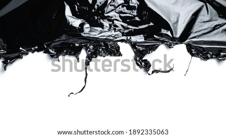 Smooth plastic texture. Black shiny film bag pattern. Wrap transparent dark cellophane isolated on white background for packaging, product protection