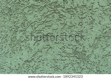 Grunge green textured concrete wall. Abstract stylish background. Decorative textured plaster, outside surface finish.