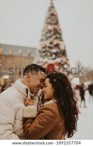 Young Beautiful Couple In Love kissing and laughing. Amazing winter holiday. Saint Valentine's Day.