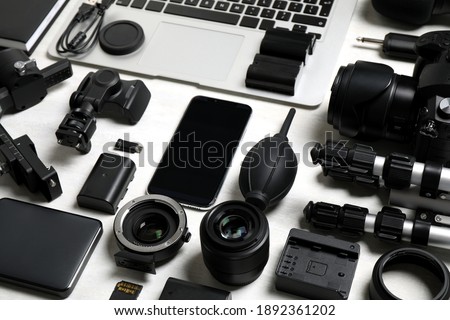 Camera equipment and accessories for video production on light background