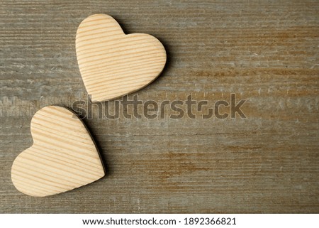 Decorative hearts and space for text on wooden table, flat lay. Valentine's Day
