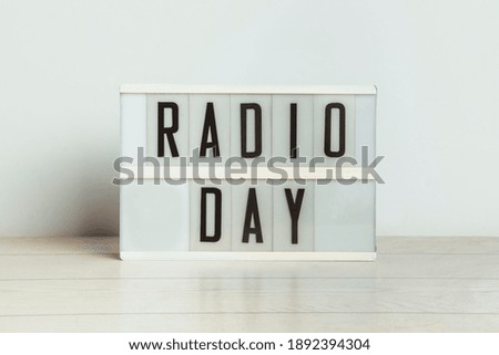 Poster that reads "Radio day" on a white background. Radio concept.