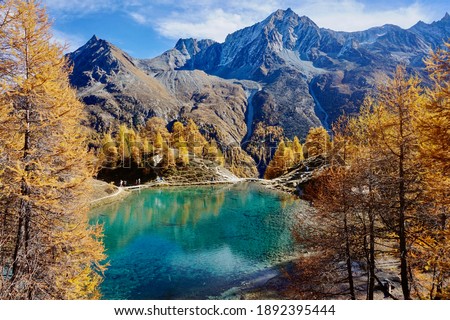 Autumn Turquoise Lake in Switzerland with Mountains in Background. Lac Bleu, Arolla. Beautiful Switzerland.  Royalty-Free Stock Photo #1892395444