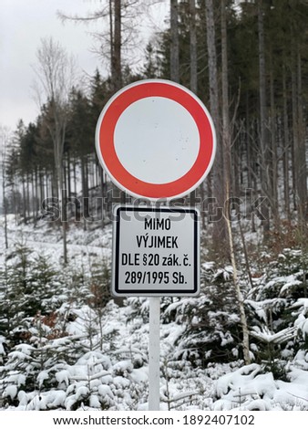 Prohibited entry road sign in the winter forest with title "out of rules on paragraph number 20 2801995"
