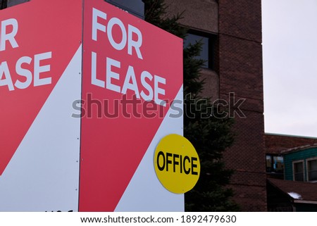 For Lease sign in front of a commercial building with Office on offer