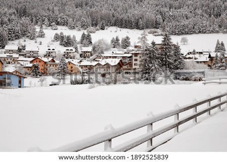 View of small colorful houses covered with snow. tour in the winter. Christmas card.