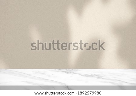 Marble Table with Bokeh Light on Concrete Wall Texture Background in Vintage White Color Tone, Suitable for Product Presentation Backdrop, Display, and Mock up.