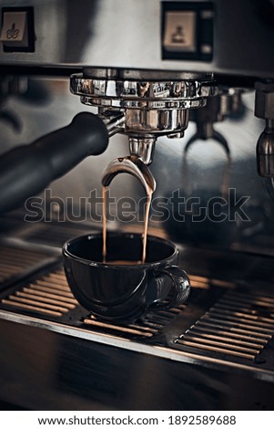 Espresso machine working with bar interior background