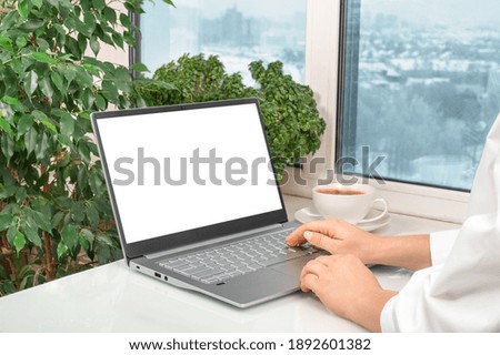 notebook laptop mockup image. blank screen white background for advertising text, hand woman using laptop contact business search information on desk at home office. hands using mockup laptop