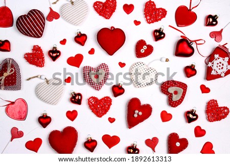 Many different hearts on a white background. Valentine's day composition.