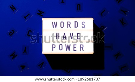 Lightbox with text WORDS HAVE POWER. Motivational Words Quotes Concept. Colorful background. Minimalistic creative concept.