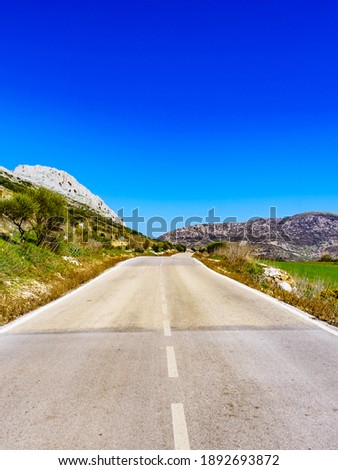 Road through nature reserve in the Sierra del Torcal mountain range near Antequera city, province Malaga, Andalusia, Spain.