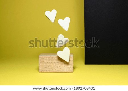 flying hearts on a yellow and black background