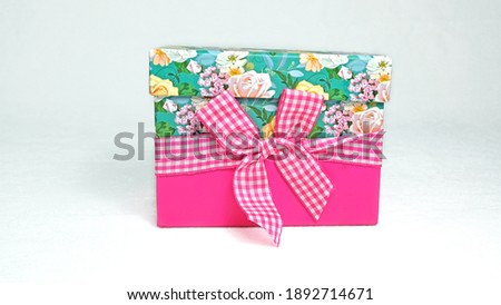 Pink gift on a white background
