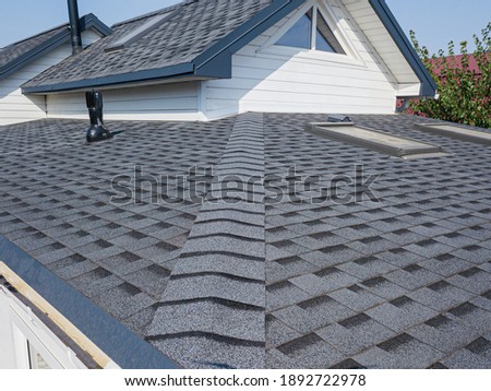 Shingles texture - close up view of asphalt roofing shingles Royalty-Free Stock Photo #1892722978