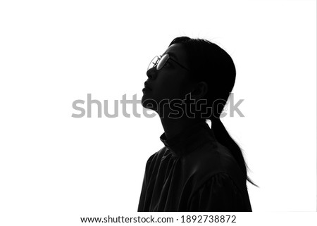 Silhouette of young asian businesswoman. Royalty-Free Stock Photo #1892738872