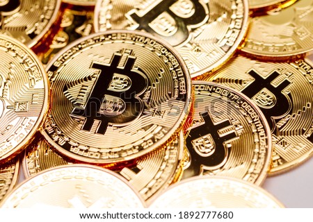 Background of gold coins with bitcoin sign