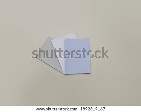 Blank colorful paper mockups on green background