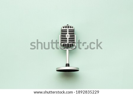 Retro style microphone. Aydio recording background. Top view