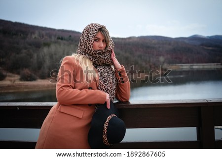 Portrait of a young girl in a forest, near lake in eastern Serbia.
