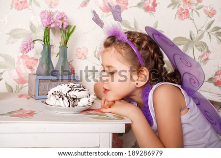 Portrait of cute smiling little girl in princess dress 