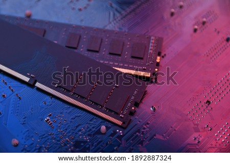 Computer memory RAM on motherboard background . Close up. system, main memory, random access memory, onboard, computer detail. Computer components . DDR3. DDR4. DDR5 Royalty-Free Stock Photo #1892887324