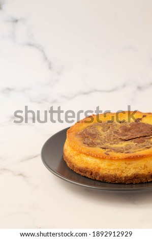 Cauliflower  and chocolate cheesecake on a white background.