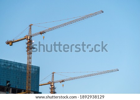 cranes are working, for skyscrapers construction, photo took in Zhuhai city, CHINA.