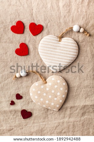 Flatlay hearts on a linen tablecloth. Valentine's Day background. Copy space.