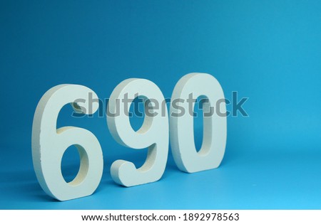 690 ( Six hundred ninety ) Isolated blue Background with Copy Space - Number 690% Percentage or Promotion - Discount or anniversary concept 