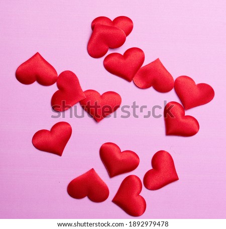 Valentine's day many red hearts on pink paper background, love concept for 14 february or valentine day