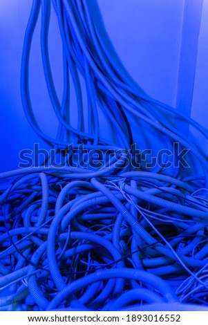 Pile of cables on floor in new building. Electricity installation and interior renovation. Closeup.