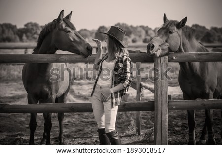 Horse farm concept, hobby -  rider. Woman talk with a horse, eco tourism 