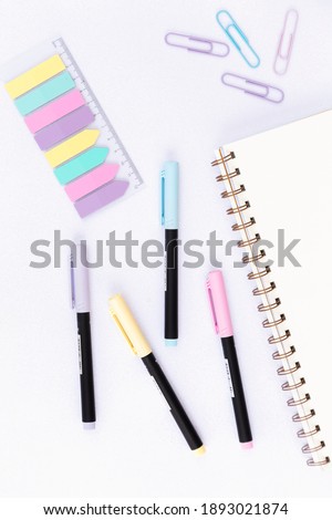School and office Supplies on a glitter background