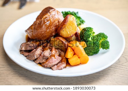 Classic Sunday Roast Dinner With Mixed Vegetables  Royalty-Free Stock Photo #1893030073