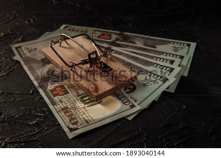 Mousetrap with free bait and dollar bills. Trap, money scam concept