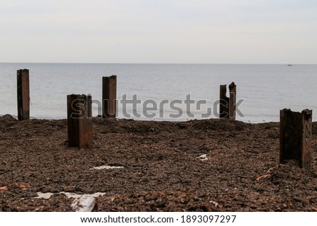Breakwaters and beach scenery along the shores of Helgoland in the Waddell Sea off the coast of Germany