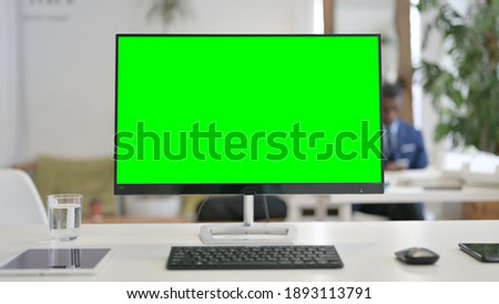 Close Up of Desktop with Green Chroma Key Screen 
