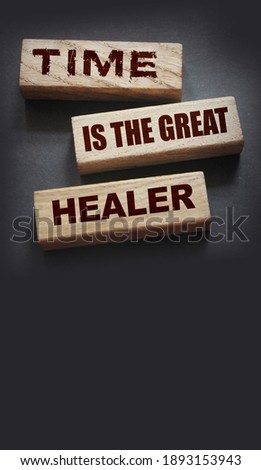 Time is the best healer words on wooden blocks. End of relationship and soul pain concept.
