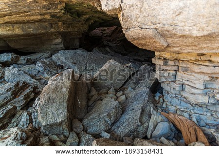 Bonnechere Caves Conservation Area in Eganville Renfrew Canada in autumn featuring caves in jagged rocks on a sunny day
