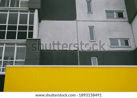 Color 2021 apartment building in winter isolated. Colors yellow and gray. Color of the year of 2021. Illuminating , Ultimate Gray.