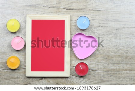 Wooden photo frames and decorations for Valentine's Day and have copy space.