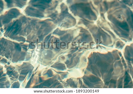 Blur effect soft focus nature real rippled sea ocean water surface. Abstract background design wallpaper. Underwater waves on sun beams day, water everywhere. Toned photo collection DARK